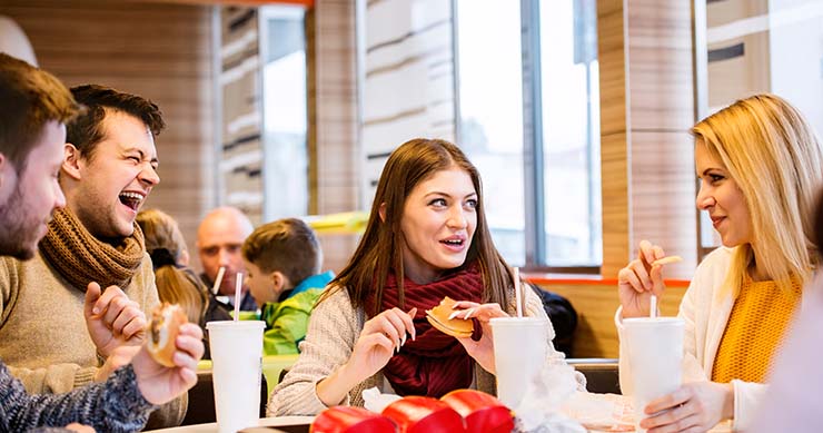 Friends eating out at fast food restaurant