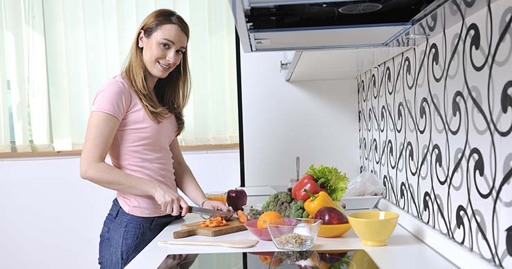 girl preparing veggie foods in the kitchen