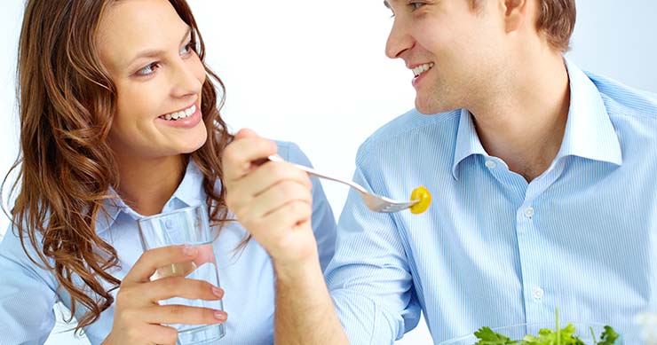 Guy and Girl chatting with each other while eating
