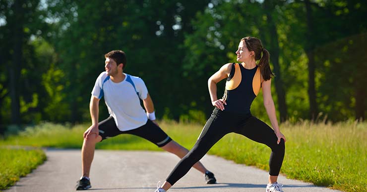 man and girl stretching