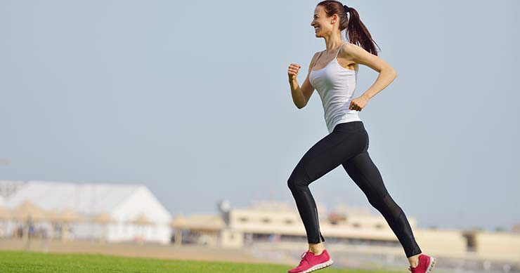 girl jogging with blurred background